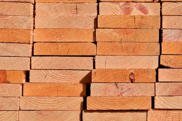End view of stacked wooden planks