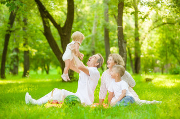 Fototapeta premium Grandmother and grandfather having fun on a picnic in nature