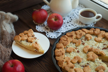 Autumn breakfast with tea and apple pie. Homemade seasonal organic food - apple galette with honey, walnuts and cinnamon for Thanksgiving day.