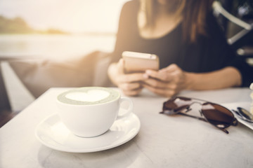 Young asian woman using mobile phone and texting in social network