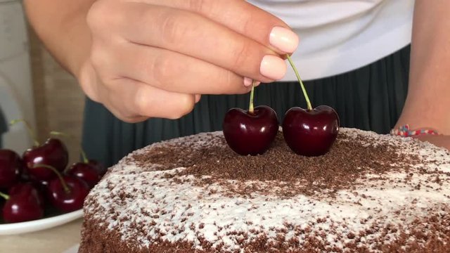 Girl in Kitchen make Beautiful put two cherry in powder delicious chocolate moving forward background wood white Pano delicious art black berry strawberry mint black dessert baker cherry powder 
