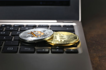 Bitcoins on a laptop keyboard