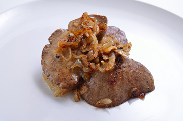 Rabbit liver roasted on white plate.