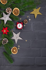 Christmas fir tree with decoration and red clock