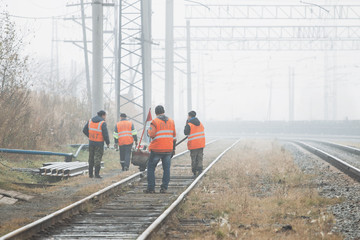 Railroad workers maintaing railways