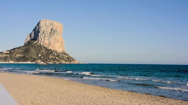 Arenal beach with Penon de Ifach mountain. Mediterranean sea in Calpe, Spain.
