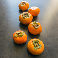 Ripe persimmon . Concept -  healthy eating, vegetarianism. Selective focus.