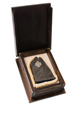 Wooden box with a souvenir inside on a white background