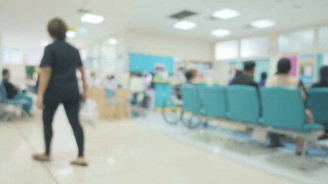 Blurred image of many people sitting on the chair in hospital