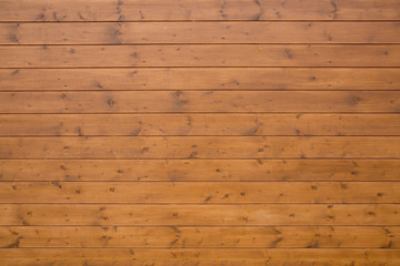 a brown wooden background consisting of an alloyed board
