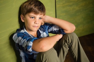 Boy sitting at home