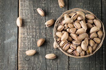 Healthy mix nuts on wooden background. Almonds, hazelnuts, cashews, peanuts, pistachios, brazilian nuts