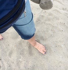 Barfuß am Sandstrand laufen