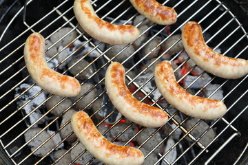 Sausages on barbecue grill