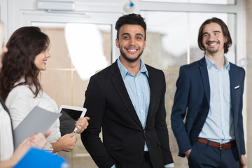 Hotel Receptionist Meeting Business People Group In Lobby, Guests Arrive