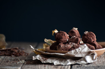 Handmade truffle on an old wooden table..