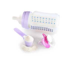 Baby milk formula and pacifier on white background