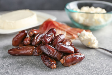 Ripe dates on grey background