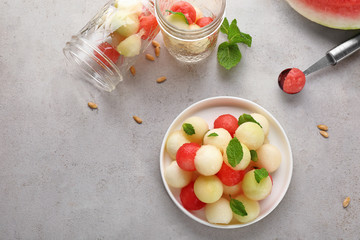 Plate of melon and watermelon balls on table
