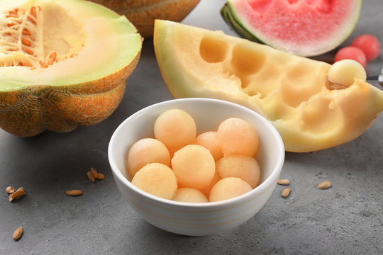 Bowl with delicious melon balls on table