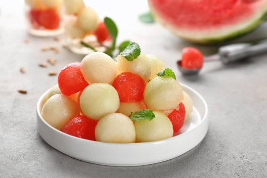 Plate of melon and watermelon balls on table