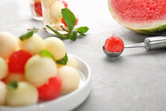 Composition with tasty melon and watermelon balls on table