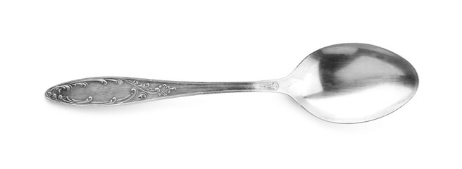 Teaspoon with ornate handle on white background