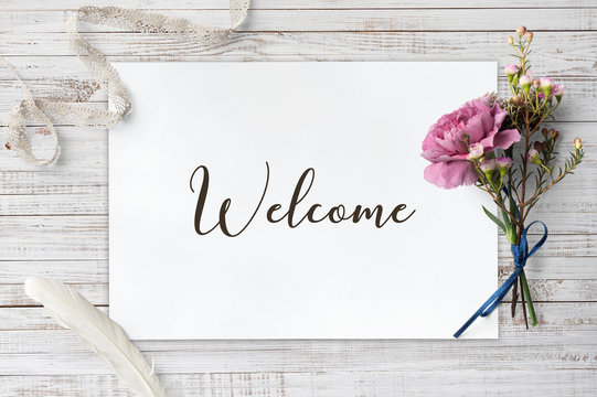 Welcome  - calligraphy on paper sheet with decorative items
