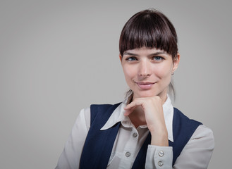  business woman holding tablet on gray background. Studio shoot