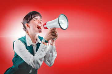 Beautiful girl yelling at the shout on red background. Concept of calling in advertising. Studio shooting.