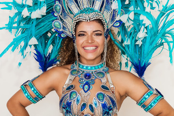 Beautiful and cheerful samba dancer portrait wearing blue traditional costume