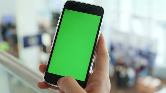 closeup man hand using smartphone green screen mockup blank display indoor businessman wifi connect pda tapping finger pointing social networking create sharing content chat online digital gadget 3g