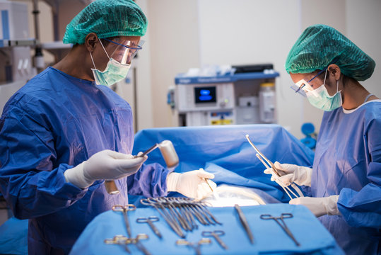 team of surgeons working in the operating room  