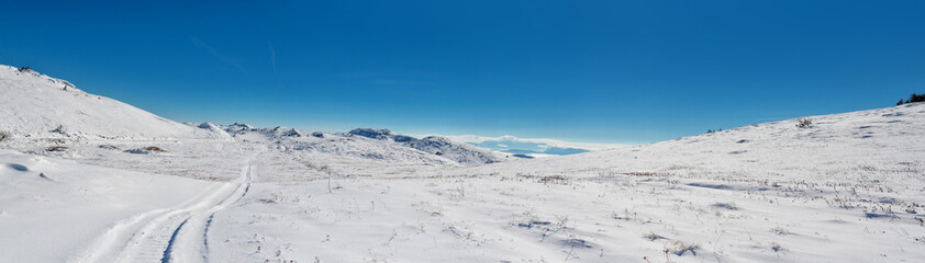 Fototapeta na wymiar Top of the mountain under snow in the winter