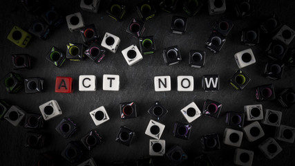 The inscription from the colored letters on a dark background 