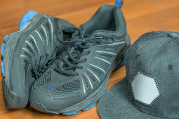 Sports equipment: baseball cap and pair of sneakers