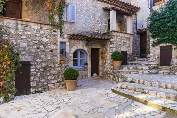 Fototapeta na wymiar Narrow cobbled streets with flowers in the old village Gourdon, France