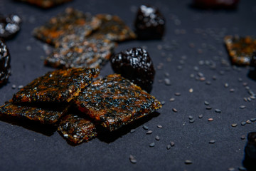 vegan cereal crackers on a black background