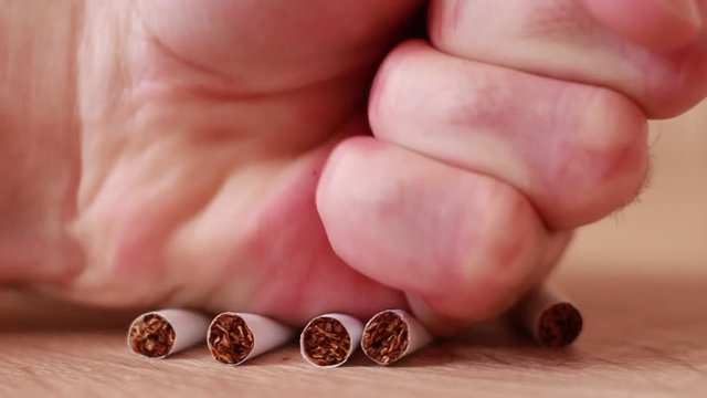 Pressing cigarettes with fist
