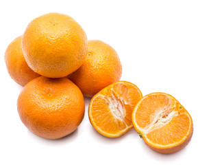 Four whole Clementines and two halves isolated on white background