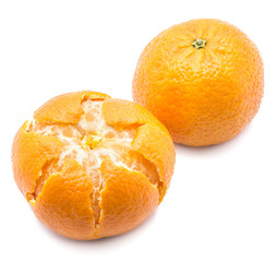 Pair of peeled and unpeeled Clementines isolated on white background