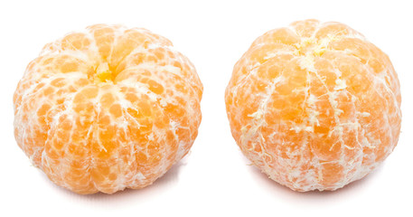 Two peeled Clementines isolated on white background