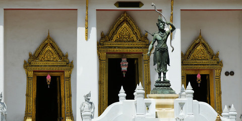 statue at the entrance of buddhist temple