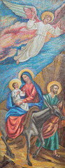 Fototapeta na wymiar LONDON, GREAT BRITAIN - SEPTEMBER 17, 2017: The mosaic of The Flight to Egypt in St. Peter Italian church from 20. cent.