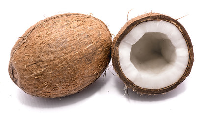 One whole coconut and one half isolated on white background