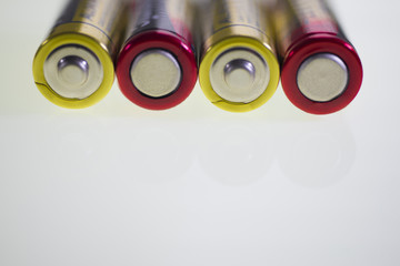Battery positive cathode on the white backdrop.