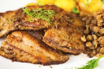 Fried fish, lentil and potato.