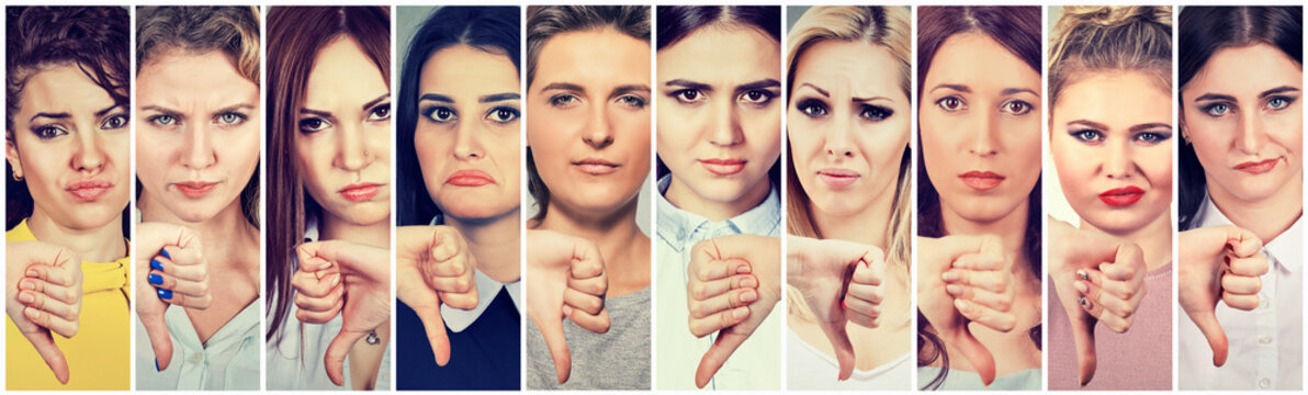 Group of multicultural women making thumbs down gesture for disagreement