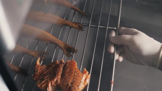 Smokehouse of fish in seafood restaurant. Smoked mackerel. Smoked fish. Dorado sea bass, smelt mullet