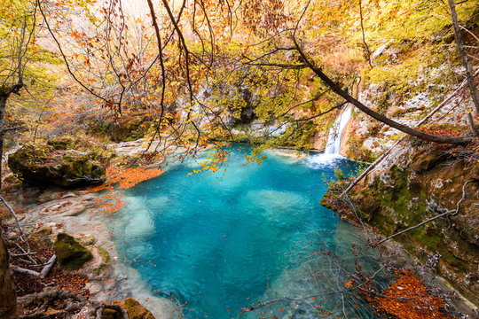 colorful autumn landscape at urederra source, Spain